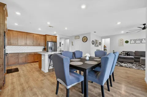 a view of a dining room with furniture and wooden floor