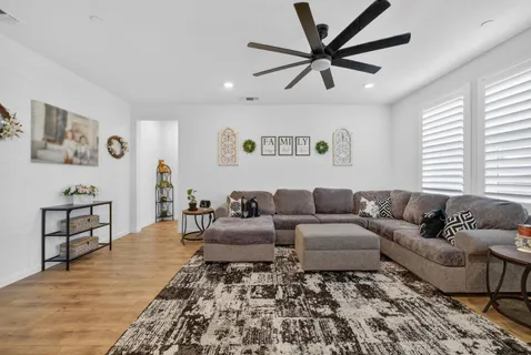 a living room with furniture and window