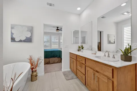 a bathroom with a bathtub and a shower