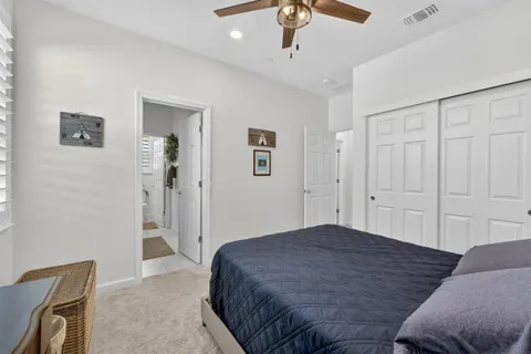 a bedroom with a bed and a dresser