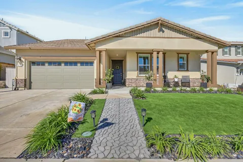 front view of a house with a yard