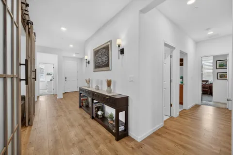 a view of a livingroom with furniture and wooden floor