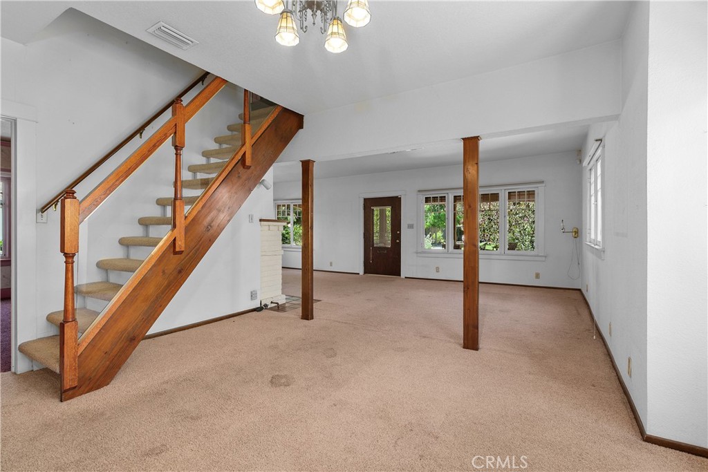 3892 Oakwood Place Riverside, CA 92506 - Photo 10 of 36 The stairway leading upstairs is adjacent to the dining room.