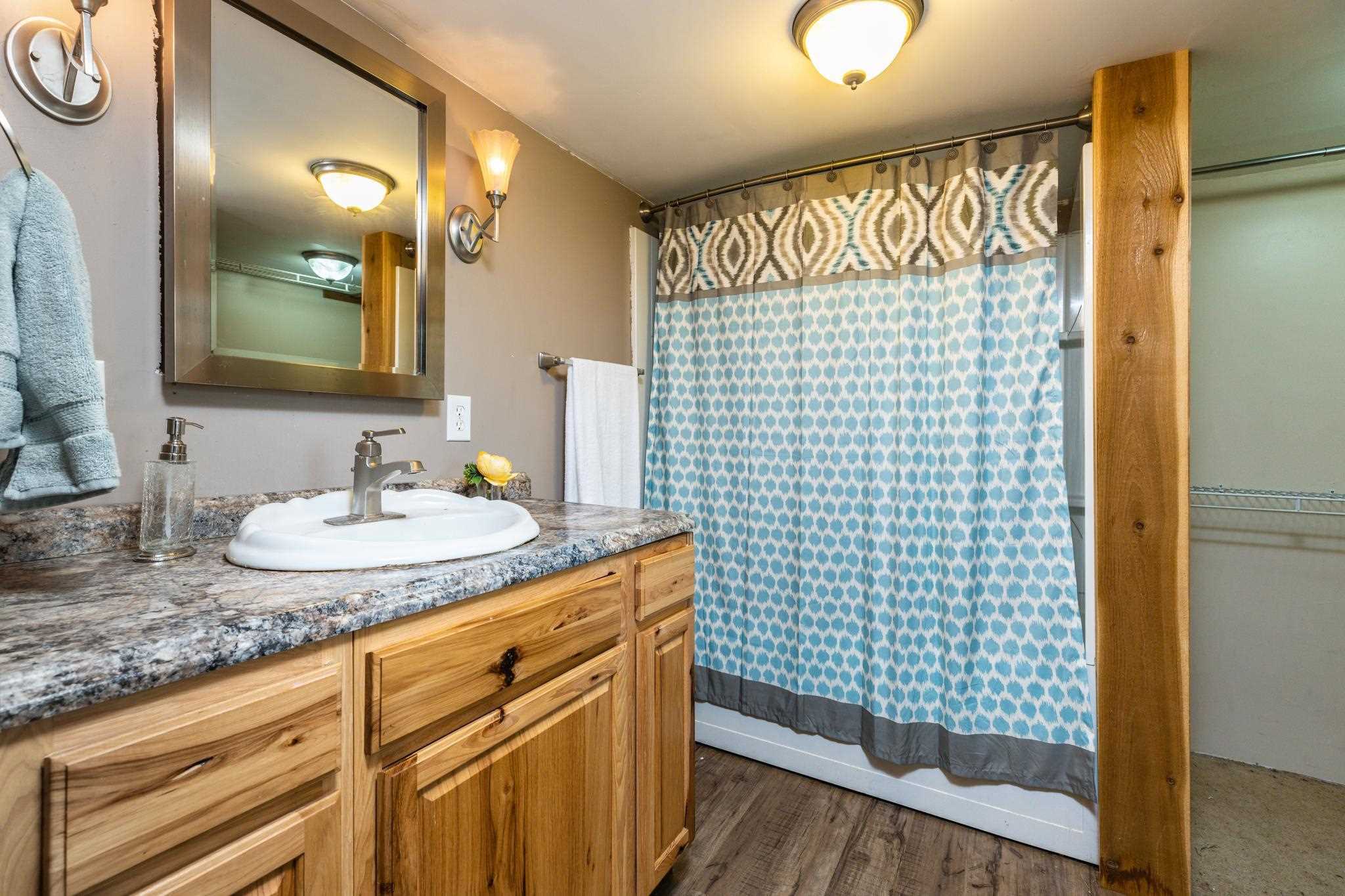 1762 Mt Torrey Road Lyndhurst, VA 22952 - Photo 17 of 46 a bathroom with a granite countertop sink and a mirror