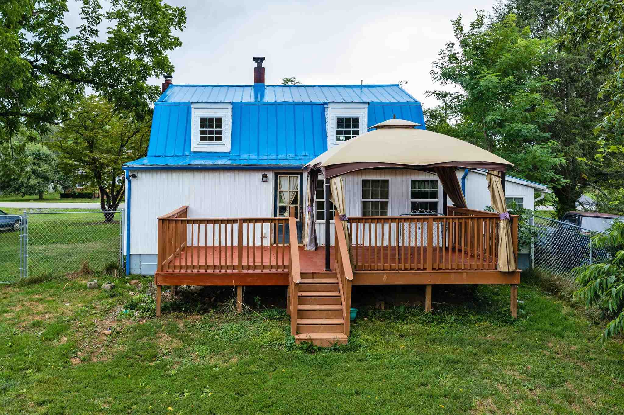 1762 Mt Torrey Road Lyndhurst, VA 22952 - Photo 34 of 46 a view of a house with a yard and a deck