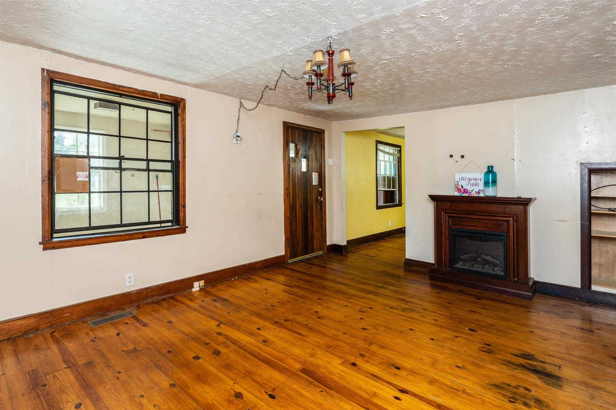1762 Mt Torrey Road Lyndhurst, VA 22952 - Photo 9 of 46 a view of an empty room with a fireplace and a window