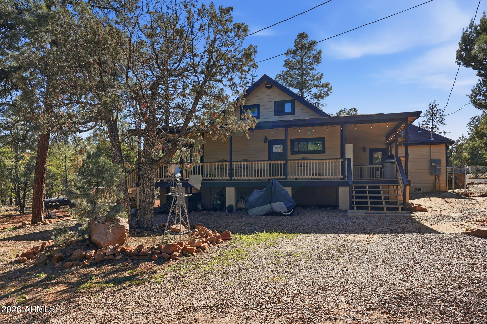 2060 Gilbert Lane Overgaard, AZ 85933 - Photo 15 of 87 a front view of a house with garden