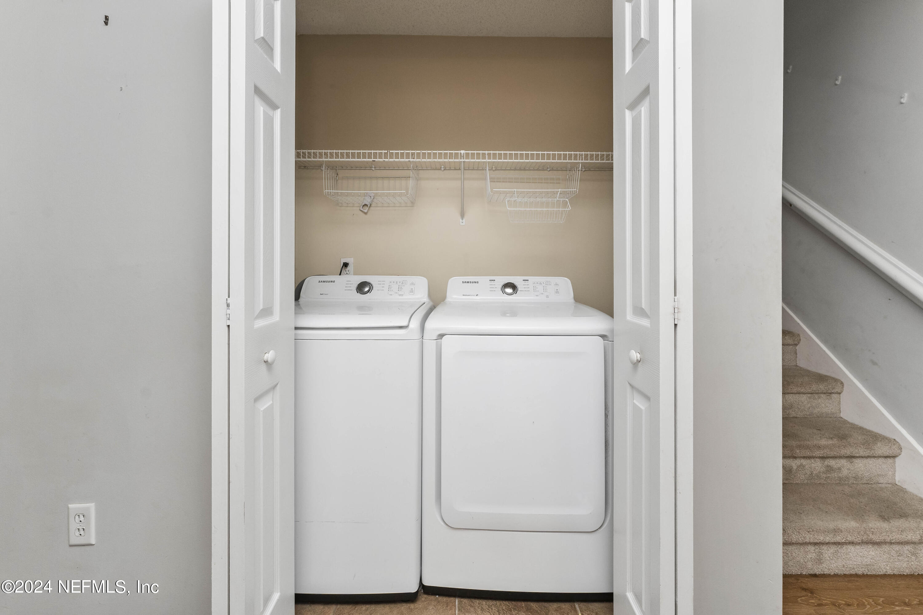587 Selva Lakes Circle Atlantic Beach, FL 32233 - Photo 11 of 31 a utility room with dryer and washer