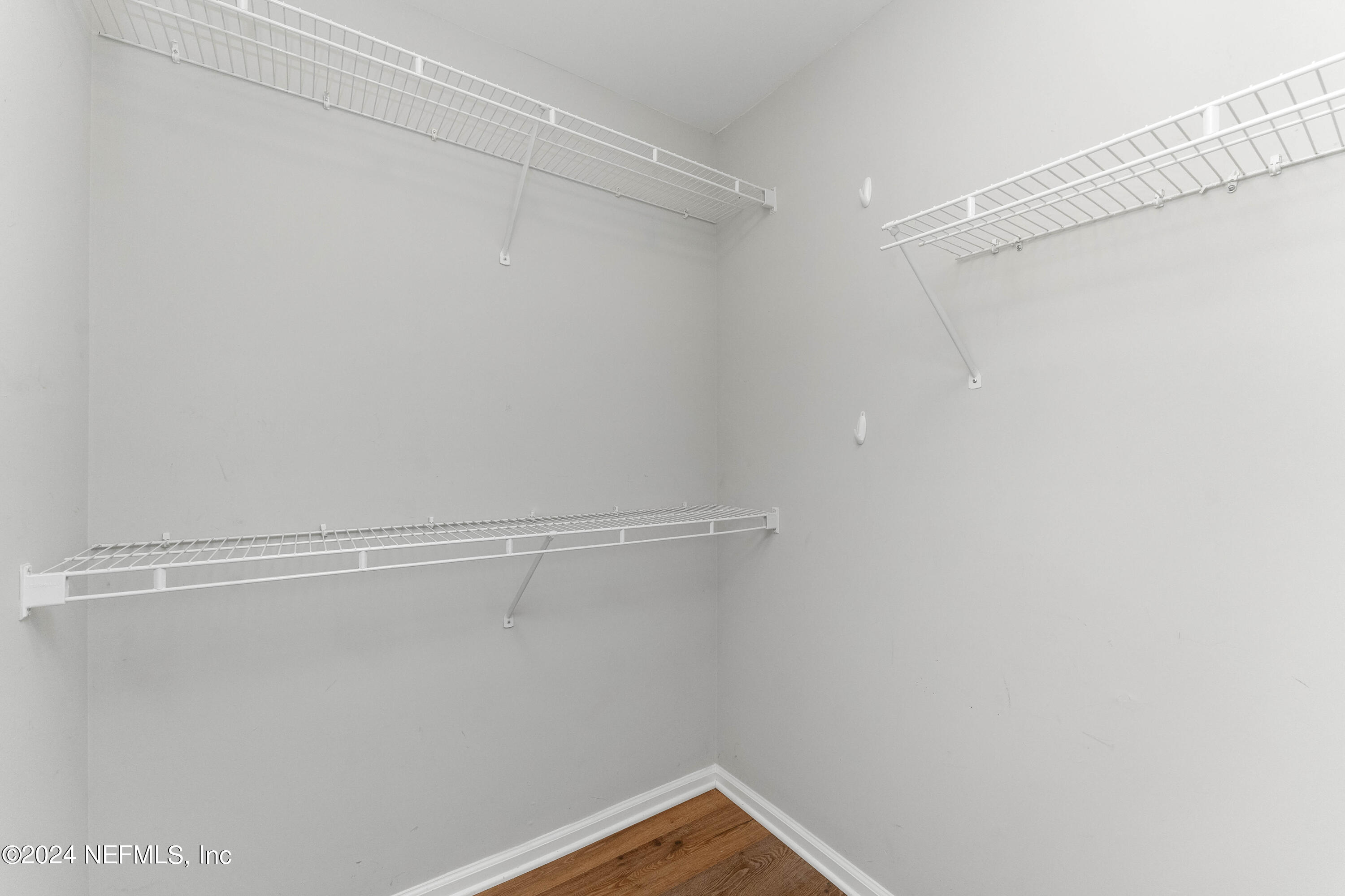 587 Selva Lakes Circle Atlantic Beach, FL 32233 - Photo 16 of 31 a view of a room with racks on the wall