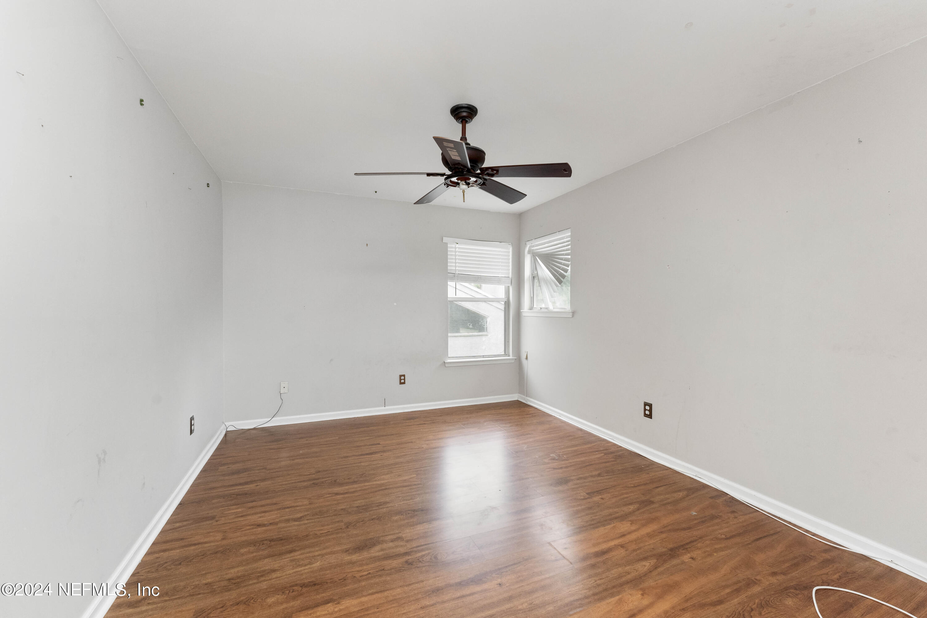 587 Selva Lakes Circle Atlantic Beach, FL 32233 - Photo 20 of 31 a view of empty room with wooden floor