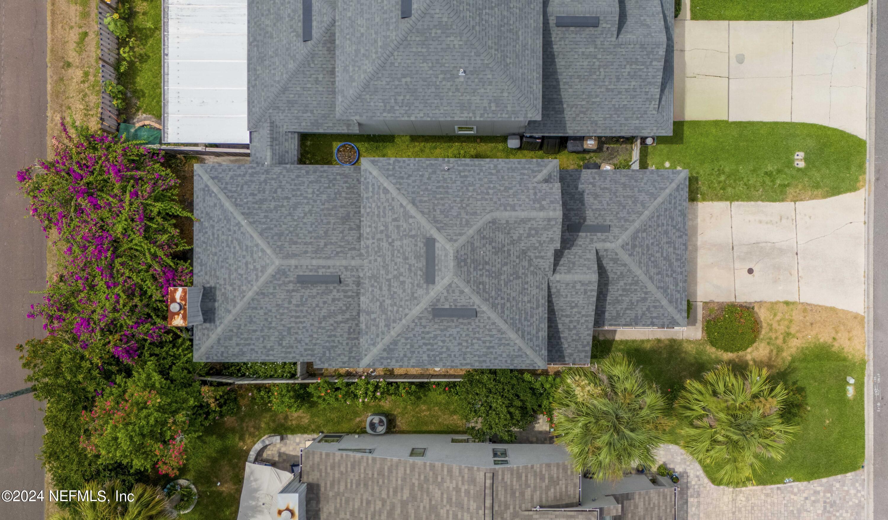 587 Selva Lakes Circle Atlantic Beach, FL 32233 - Photo 21 of 31 an aerial view of a house with a yard and a fountain