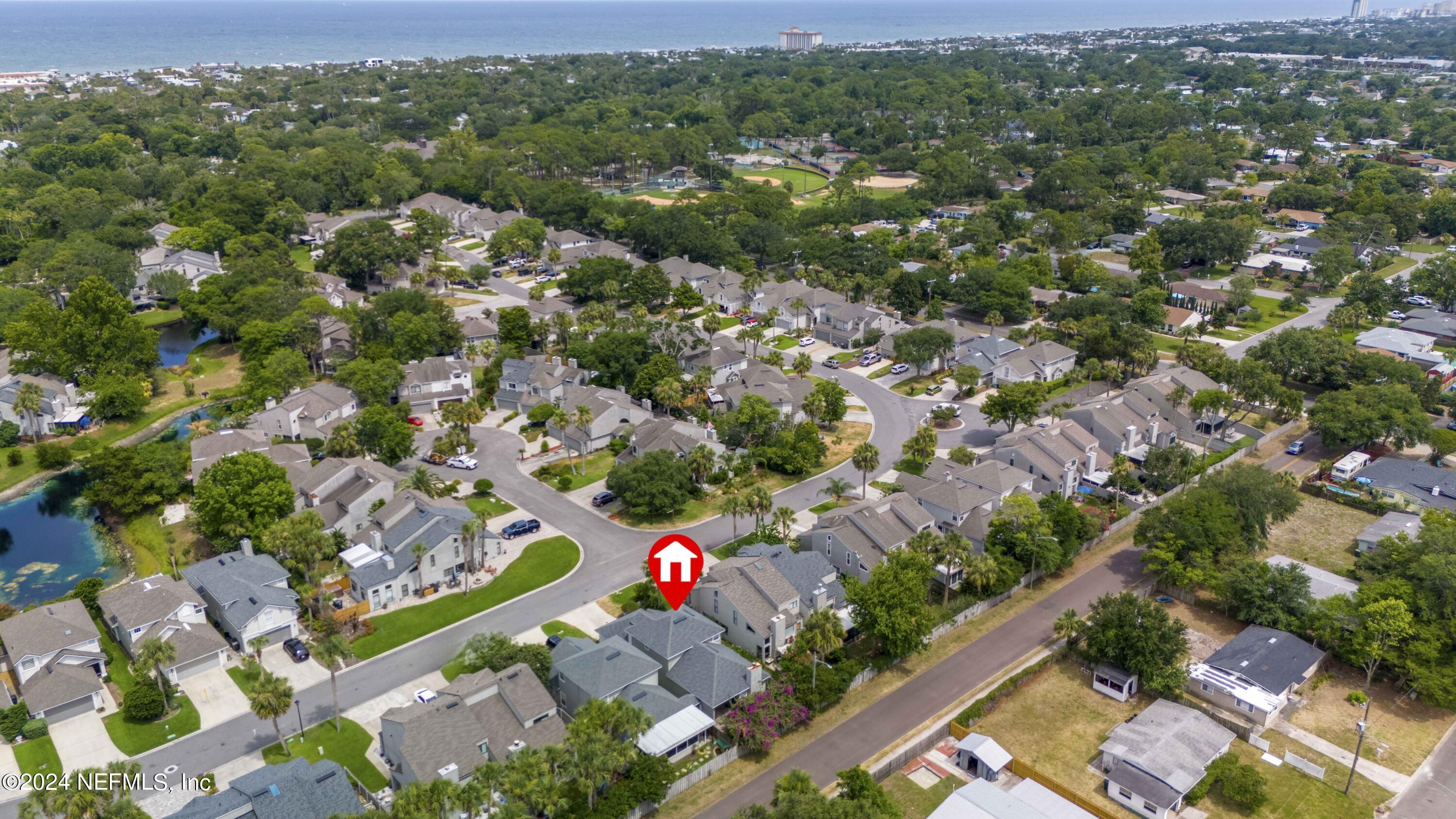 587 Selva Lakes Circle Atlantic Beach, FL 32233 - Photo 23 of 31 an aerial view of residential houses with outdoor space and trees