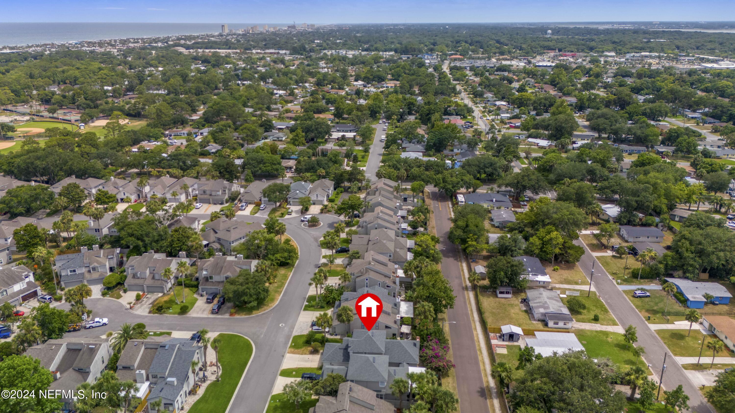587 Selva Lakes Circle Atlantic Beach, FL 32233 - Photo 24 of 31 an aerial view of residential building with green space