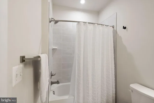 a bathroom with a shower and a tub