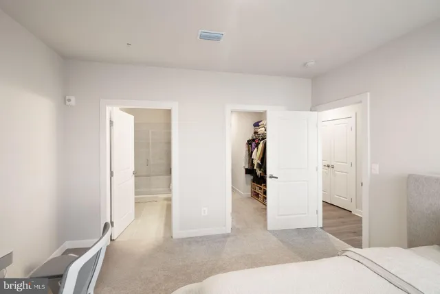 a room with a bed and a view of bathroom