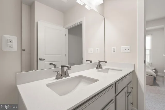 a bathroom with a sink and a mirror