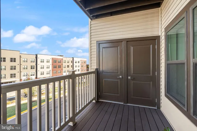 a view of a balcony with wooden floor