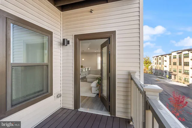 a view of a balcony and a livingroom