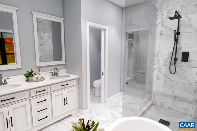 a bathroom with a granite countertop sink mirror and shower