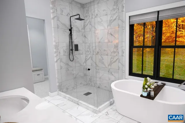 a bath tub sitting next to a window