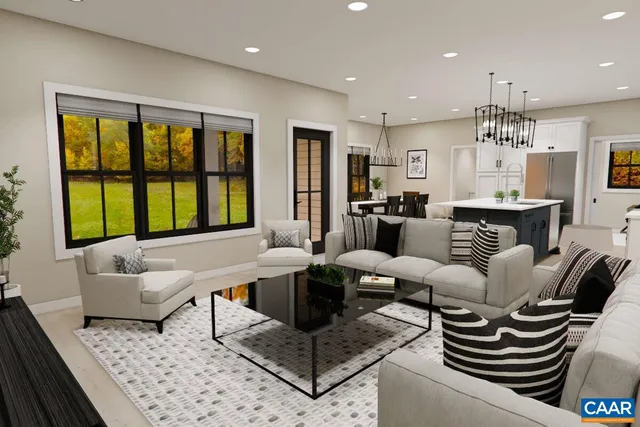 a living room with furniture a large window and a table