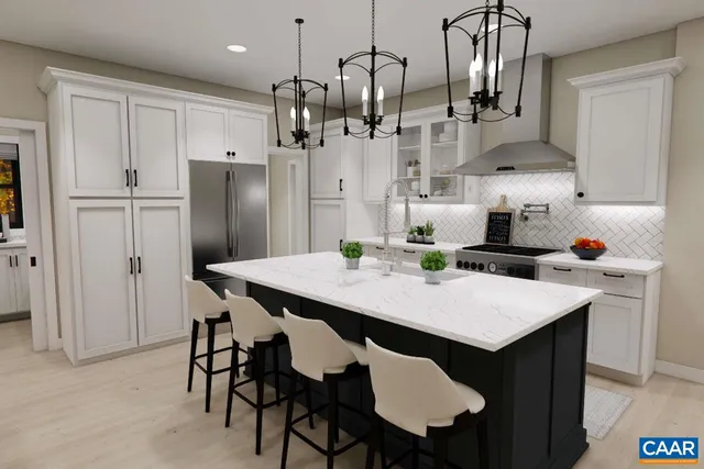 a kitchen with stainless steel appliances a table chairs and refrigerator