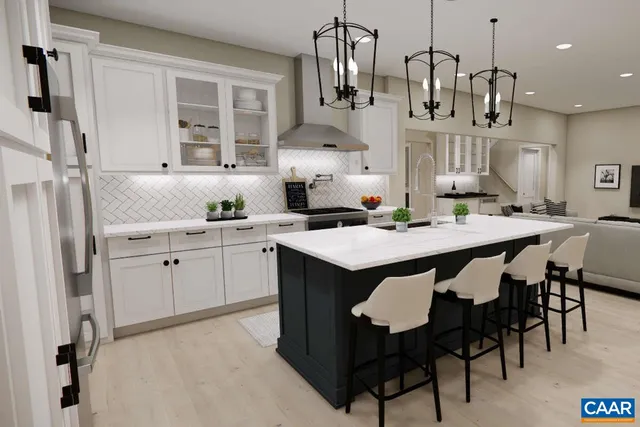 a kitchen with cabinets and chairs