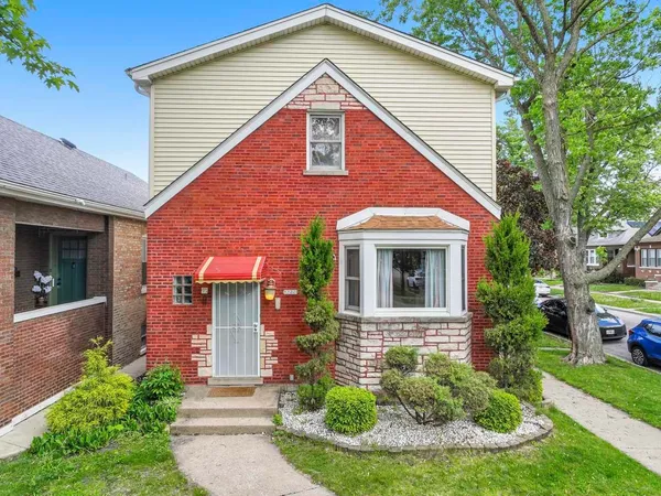 front view of a house with a yard