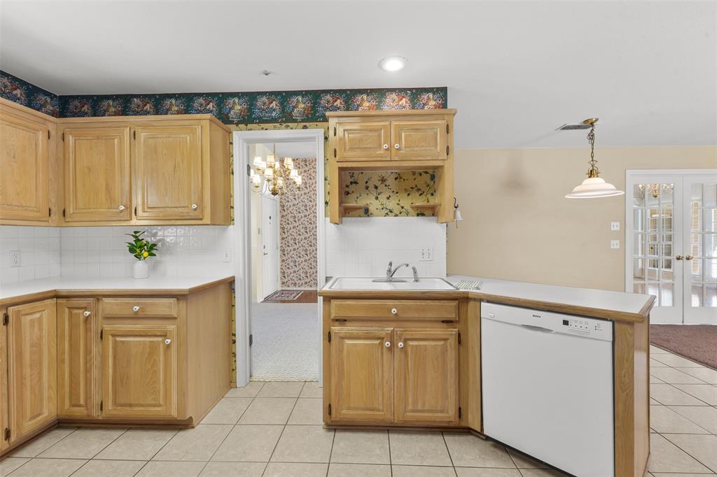 1516 Ryan Road Sulphur Springs, TX 75482 - Photo 13 of 37 a kitchen with a sink and cabinets