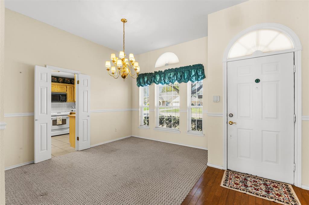 1516 Ryan Road Sulphur Springs, TX 75482 - Photo 17 of 37 a big room with windows and chandelier