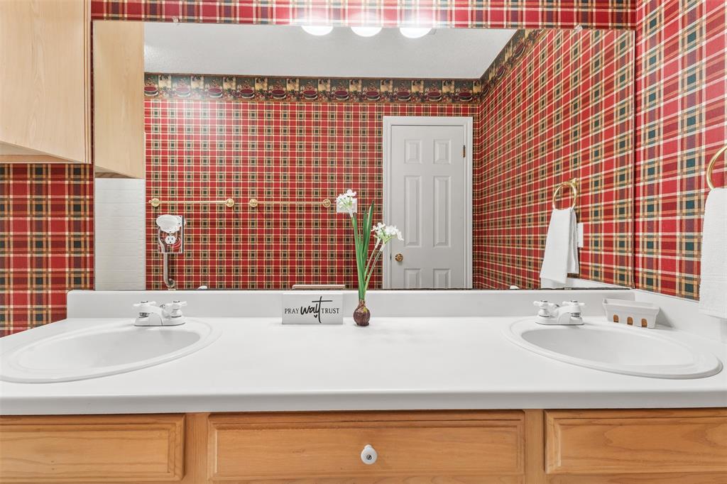 1516 Ryan Road Sulphur Springs, TX 75482 - Photo 32 of 37 a bathroom with a sink and a bathtub