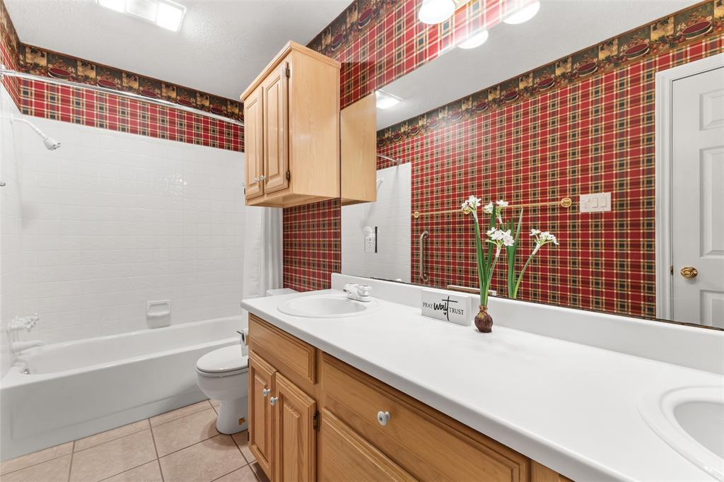 1516 Ryan Road Sulphur Springs, TX 75482 - Photo 33 of 37 a bathroom with a sink a toilet and shower