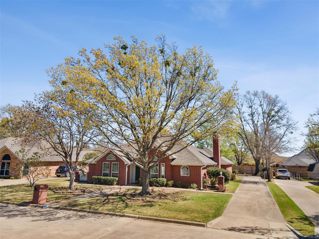 1516 Ryan Road Sulphur Springs, TX 75482 - Photo 7 of 37 a front view of a house with a yard