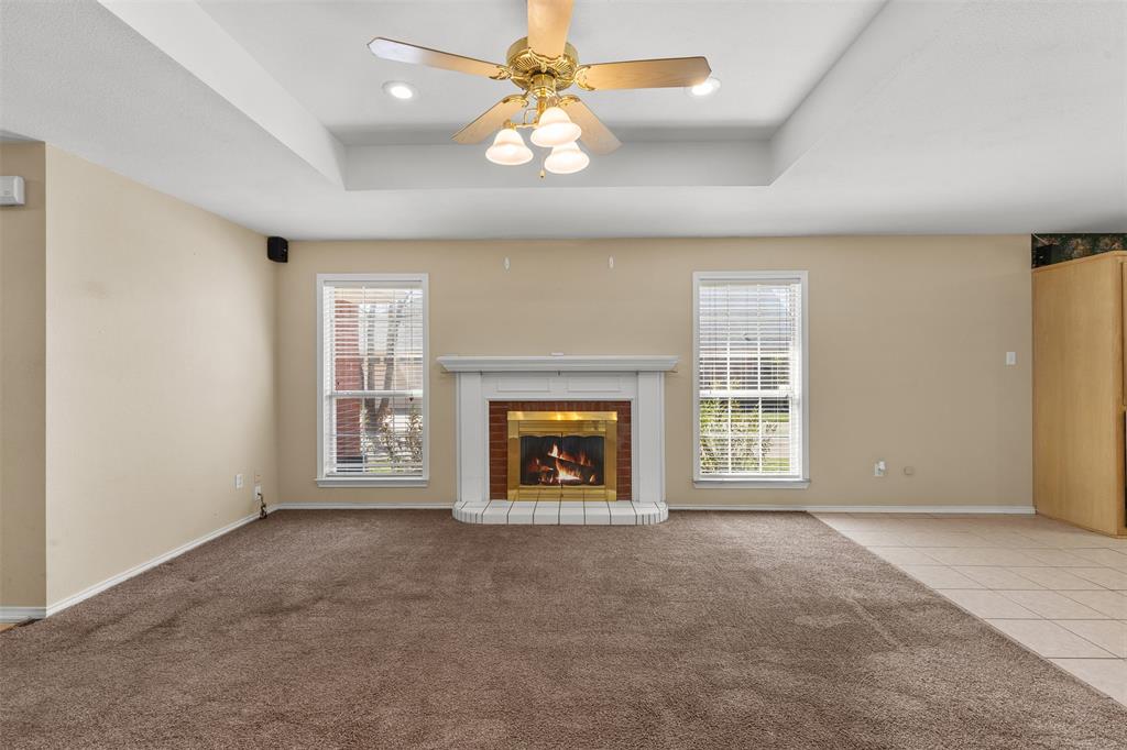 1516 Ryan Road Sulphur Springs, TX 75482 - Photo 8 of 37 an empty room with windows and fireplace