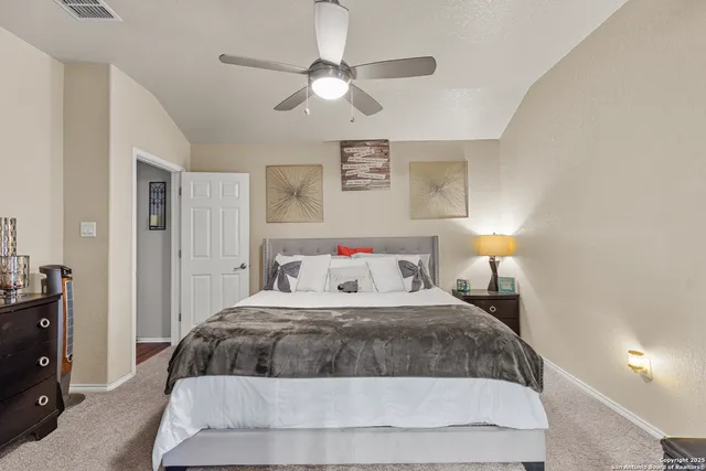 a bathroom with a sink mirror and a shower