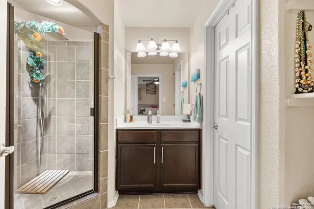 a work room with furniture and a flat screen tv