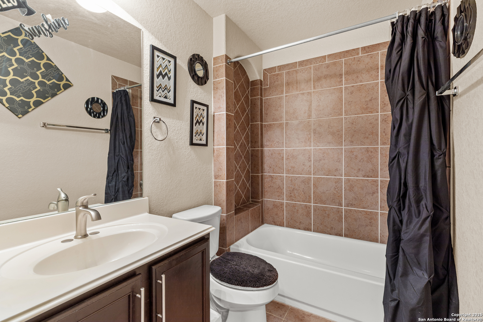 3819 Bacall Way Converse, TX 78109 - Photo 16 of 19 a bathroom with a sink a toilet and a mirror