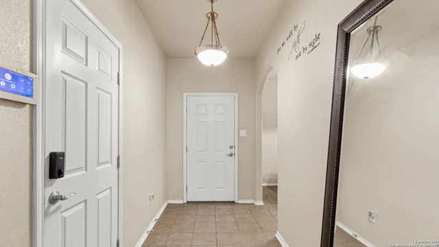 a living room with furniture a rug and a window