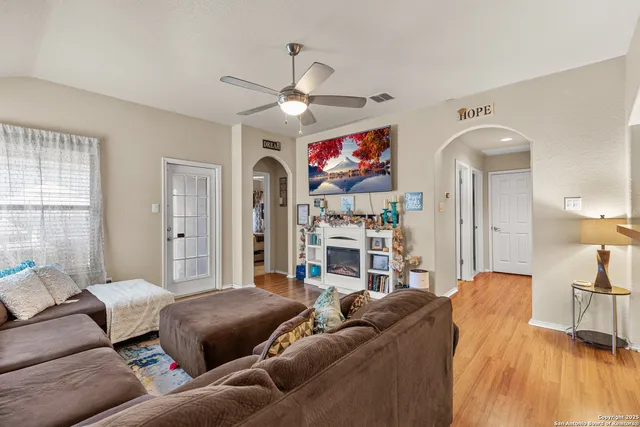 a kitchen with stainless steel appliances granite countertop a refrigerator a stove a sink and a refrigerator