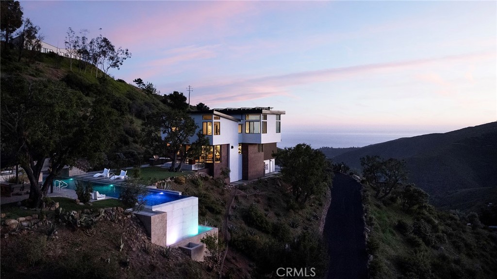 12530 Stagecoach Road Malibu, CA 90265 - Photo 2 of 45 a view of a house with a yard and garden