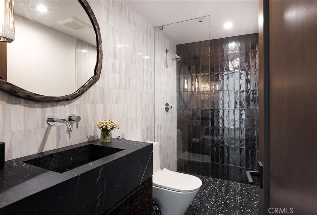 12530 Stagecoach Road Malibu, CA 90265 - Photo 22 of 45 a bathroom with a sink a toilet and a mirror