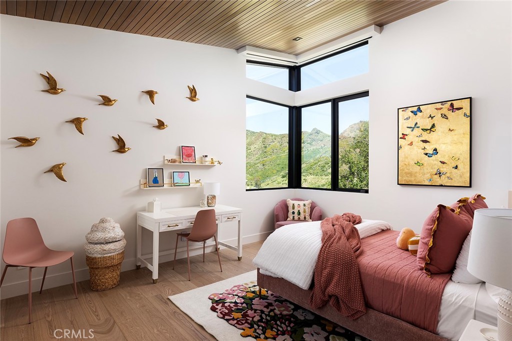 12530 Stagecoach Road Malibu, CA 90265 - Photo 24 of 45 a bed room with a bed and a chair