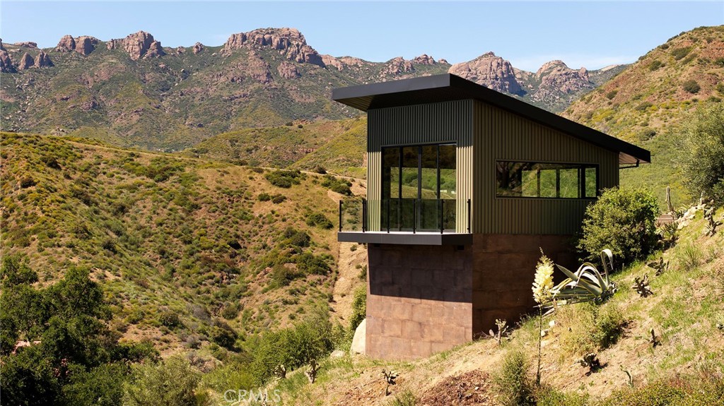 12530 Stagecoach Road Malibu, CA 90265 - Photo 36 of 45 a front view of a house with a yard