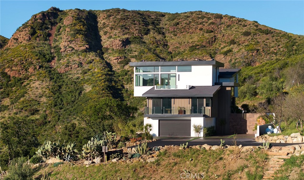 12530 Stagecoach Road Malibu, CA 90265 - Photo 37 of 45 a front view of a house with a yard