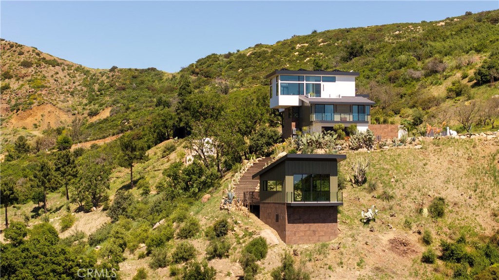 12530 Stagecoach Road Malibu, CA 90265 - Photo 38 of 45 a front view of a house with a yard