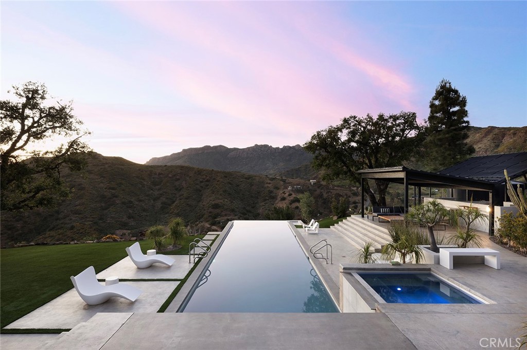 12530 Stagecoach Road Malibu, CA 90265 - Photo 39 of 45 a view of a terrace with couches and a table