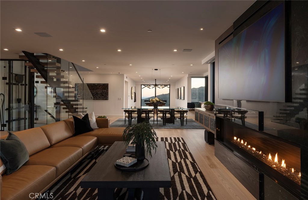 12530 Stagecoach Road Malibu, CA 90265 - Photo 42 of 45 a living room with furniture and a flat screen tv