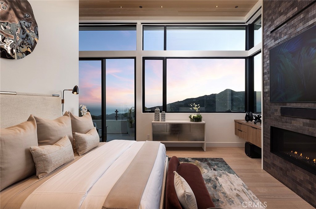 12530 Stagecoach Road Malibu, CA 90265 - Photo 44 of 45 a bedroom with a large bed and a balcony view