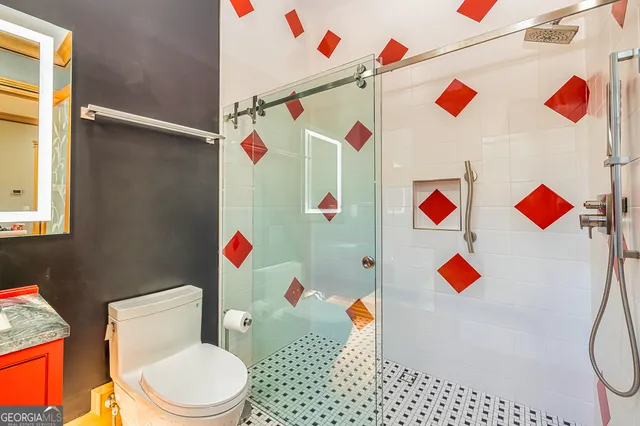 a view of a hallway with wooden floor and furniture