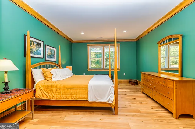 a bedroom with a bed and a dresser